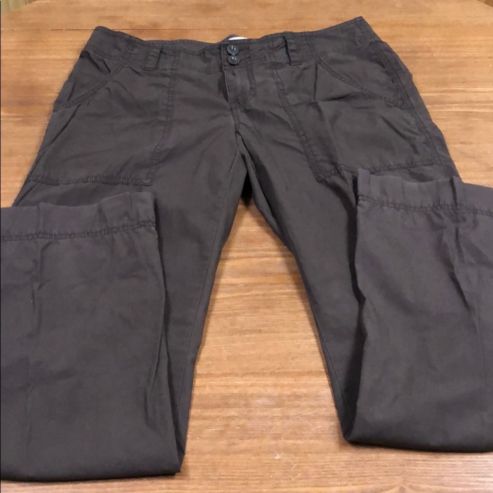 Pants with rear flap pockets.  Brown